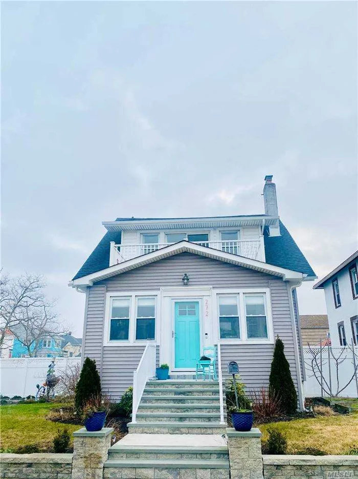 Step into this 3 bedroom, 2 bath dream home by the ocean. This charming move in ready home is conveniently located to the beach, LIRR, & Restaurants. This home is complete with an oversized yard with an above ground salt water pool (22x12), several floral and vegetable gardens, & a three season sunporch with chandelier, outdoor deck and second story deck, garage with private, gated driveway fit for several cars. Additional features include : Wood burning fireplace,  Hardwood floors, Magnificent new bathroom, fenced in yard, updated electric, walk in closets, full size basement with ample storage, New Washer/Dryer, original wood floors newly restored, 2 year old siding, gutters, and roof. Area off DR is perfect for office. This home is a wonderful year round family home or beach getaway.