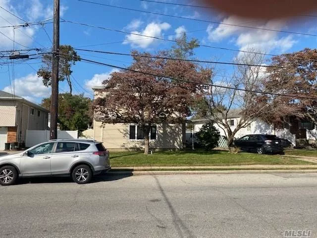 This 4 Bedroom, 2 Bath Colonial offers a Living Room and Dining Room with hardwood floors, Large EIK (with separate dining area), Den, 1st Floor Bedroom, 2 full baths, Full partially finished basement.