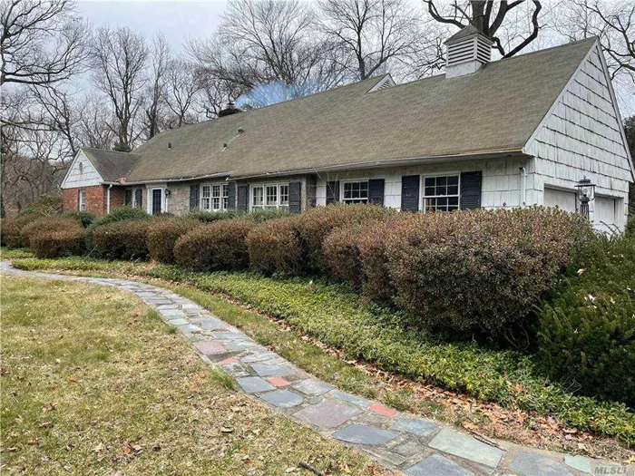 Location, Location, Location.... Fabulous Flat property on approx 1 acre lot in prime spot. Opportunity to build your dream home or renovate existing home.  House being sold As Is This 1955 cape cod has hardwood floors,  wood burning fireplaces, large scale rooms, large unfinished basement.