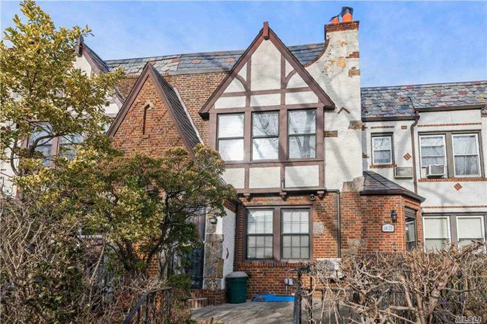 Classic 19ft Tudor Townhouse in the heart of FH. Great home W/updates, spacious L/R with WBFP. Formal DR, Renov EIK & powder room on main floor. 3 Bedrooms 1Bath W/tub & shower, M/BD has an in closed terrace, Full basement w/washer/dryer  new gas burner and hot water heater, attached one car garage. Zone for P.S. 144 Close to shopping Transportation, parks and restaurants. A MUST SEE!