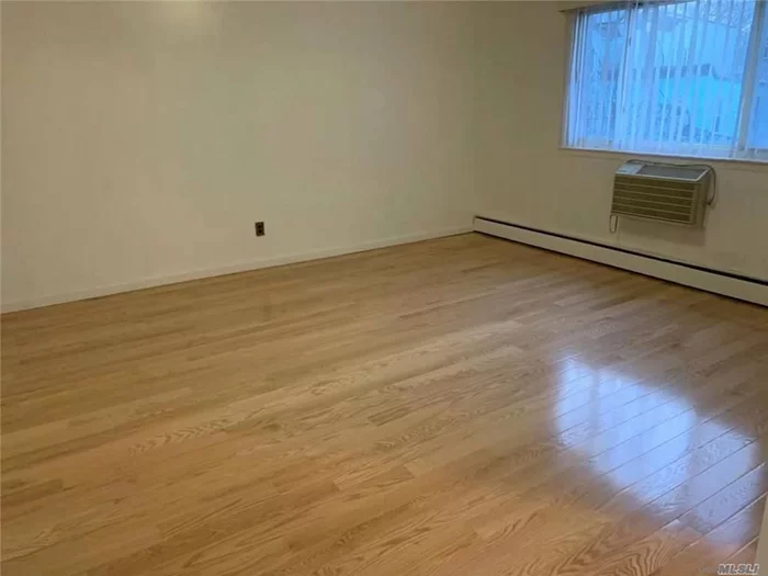 New Wood Floor, Bath. There are three bedrooms,  one full bath and large living room. It is very nice and quire area 7 Minutes To #7 Train. All Info Not Guaranteed, Prospective Tenant Should Re-Verify All Info By Self.