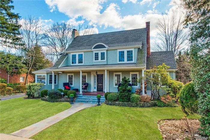 Timeless, inviting and bursting with architectural details, this 4-bedroom, 3.5-bath Center Hall Colonial, with rocking chair front porch has been thoughtfully expanded and richly updated. The spacious rooms offer exceptional scale. Living room w/fpl, sun-drenched dedicated office, banquet-sized dining room w/fpl, gourmet kitchen w/center island, great room w/stone fpl opening to bluestone patio. Powder room, butler&rsquo;s pantry & mud room complete the 1st floor. New roof, cedar shakes and new windows. Set perfectly on generous flat property & ideally located close to LIRR, Harbor and Main Street. Beach rights w/membership. A truly special home that rarely comes around.