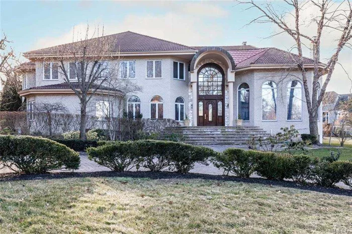 This stunning Grand Mediterranean Style Estate sits on .93 acre with views of the Long Island Sound. The exterior features include, hand cut bricks, Spanish roof, terraces, wrap around driveway, in ground pool, fire pit, gazebo and outdoor bathroom. The double height entry with granite floors and custom wrought Iron railings curved granite staircase leads you into the formal living room, family room and dining room. Additional features include, home office, guest quarters with kitchen, recording studio, full finished basement and a heated garage lined with granite.