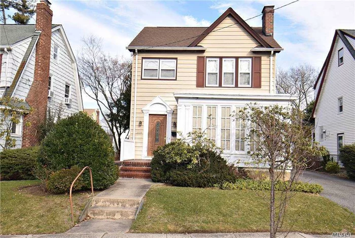 Great location, close to park, school, shopping, bus and LIRR. 3 bedroom, 2 full baths. Formal dining room, Fire Place in Living room , French doors leads to a glass enclosed porch. sky light in bathroom. wood floor throughout. Side entrance to basement and kitchen. Full finished basement with egress window and wood floor. two linen closet (1 in bathroom), closet/s in every room,  pull down stair leads to spacious attic. Detached garage with long drive way .