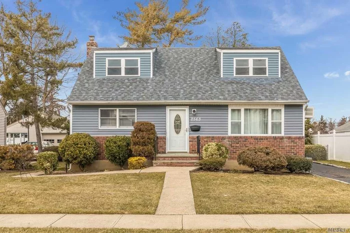 Bright and sunny move-in ready expanded cape. A perfect starter home, downsize, or income producer. The eat-in kitchen opens to the dining room. Second entrance to the upstairs and outside entrance to the basement. All rooms have been expanded upstairs. The primary bedroom has a walk-in closet and a den/office attached. Inground sprinkler system in the front and backyard. Multigenerational M/D possibilities with permits. Beautiful large flat backyard with a covered patio. This is a must-see in East Meadow!!