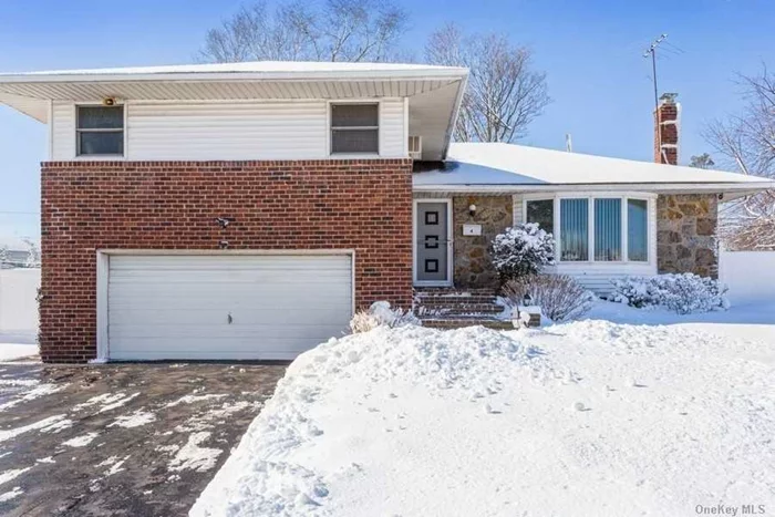 Wonderful large brick split on oversized property in Woodbury with Syosset Schools.1900 sq ft. New roof, updated windows, updated kitchen with gas cooking . Gas heating, Updated master bath .Hardwood floors throughout Finished basement perfect for playroom or home office. Fully fenced yard, over a 1/4 acre. Close to transportation and shopping. WOW!!! GREAT TAXES $14, 810 w basic star