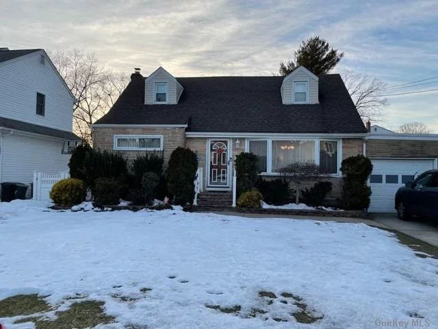 Move-in condition Merrick Manor 4 bdrm 2 bath updated approximate 1809 expanded cape on oversized lot. Living room w/bay window, Kitchen, 17x24 vaulted den with wood burning fireplace, 150 amp electric plus another a panel for the den, 2 zone heat, 3 wall A/C units, 2 window units. Finished Basement, Sep. HW Heater, Hardwood floors, Updates include: Roof - 2004, 1/2 redone Dec. 2020, Boiler - January 2020. PVC fenced yard, 5 zone IGS, Attached 1 car garage. Convenient to all!! Won&rsquo;t Last!!