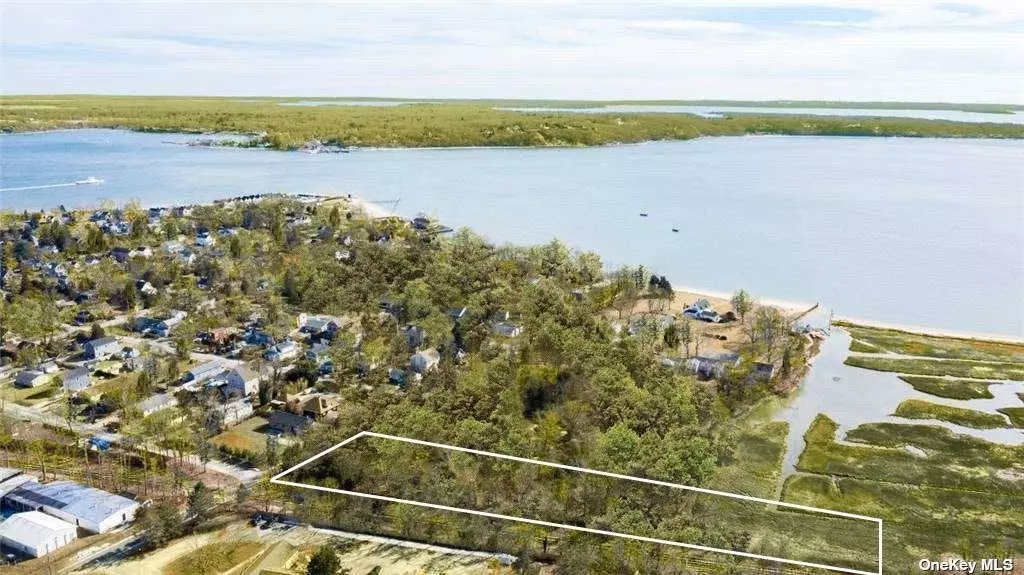 Beautiful 1.58 acre waterfront lot in Greenport. right outside Greenport Village Center, with deeded beach rights thru a 12&rsquo; path to 40&rsquo; of deep sandy bay beach, great spot to moor a small boat, take a swim. In 2008 Greenport Village granted permission to hook up to the village sewer system. Adjacent two lots also available for purchase - MLS#: 3289662 & MLS#: 3289661. Ideal opportunity to build a sustainable home with big waterview over the wetlands, creek and out to Peconic Bay. Room for sizable home, waterside pool, and outside entertaining. No one is permitted to access property without an agent present.