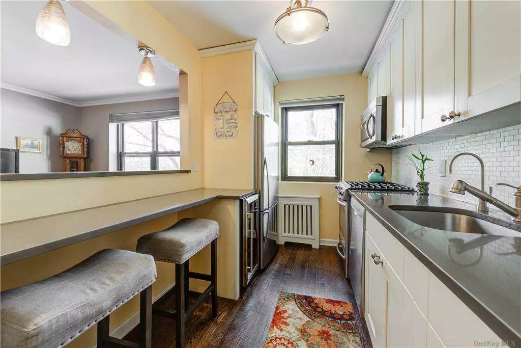 This Fantastic First Floor Apartment Has Been Renovated With Quality Materials And Craftsmanship! The Kitchen Features Quartz Counter Tops With Marble Back Splash, Cushion Close Cabinetry, A Wine Refrigerator And Wood Floors. The Bathroom Has A Pedestal Sink, Marble Tile Walls And Floor. Near Train. Parking Included.