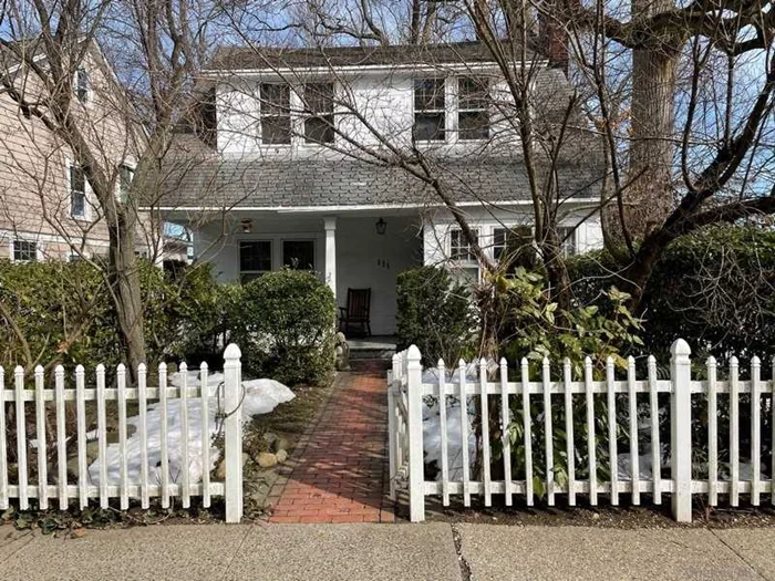 This Charming Front Porch Colonial with 3 Bedrooms X 1 full bath features on the 1st floor a living room w/fireplace, spacious dining room & eat-in kitchen. The 2nd floor offers Primary bedroom, +2 additional bedrooms and 1 full bath. Partial Basement + laundry room, Gas cooking, Gas Heat , Hardwood floors, detached 1-car garage. Close to town, LIRR. House being Sold as IS Port Washington SD