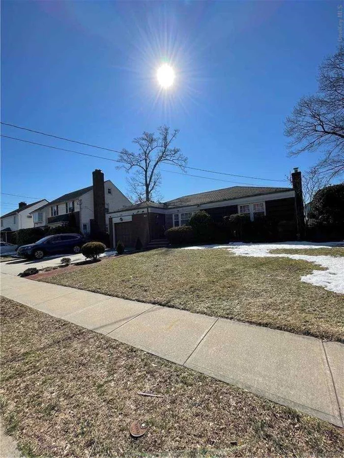 solid brick sprawling ranch in excellent condition. Large rooms throughout. Hardwood floors.Beautifully finished basement with separate entrance.Gorgeous patio and yard perfect for entertainment.Located on a very quiet residential block.Walk to all schools and parks.