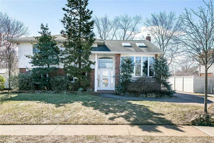 Expanded Split with Extended EIK. Living room w/ 2 skylights, Oak floors , 2 updated bathrooms.. Anderson Windows. Tremendous Family room with Fireplace leads to private over sized back yard and a detached 2.5 car garage.Partial basement finished with office.