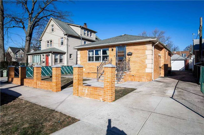 Spectacular 3 Bedroom, 1.5 Bathroom Renovated Brick Ranch in Bayside. Situated on a 40x100 lot with a long private driveway, detached garage and rear patio this home is ready to move right in. Ideally designed with hardwood floors throughout and open concept floor plan. Living room, dining area, open kitchen with breakfast bar island, Viking Professional appliances and a built-in Miele stainless steel steam oven. 3 spacious bedrooms. Solid wood interior doors. Fully tiled hall bathroom with tub and shower. Master bedroom has private half bath. Full finished basement with ceramic tile floors and high ceiling. Separate laundry room, utility room and plenty of storage, rear door to yard. Pull down access to attic for additional storage. Stainless steel railings and security storm doors.  Ideal home in an ideal location.