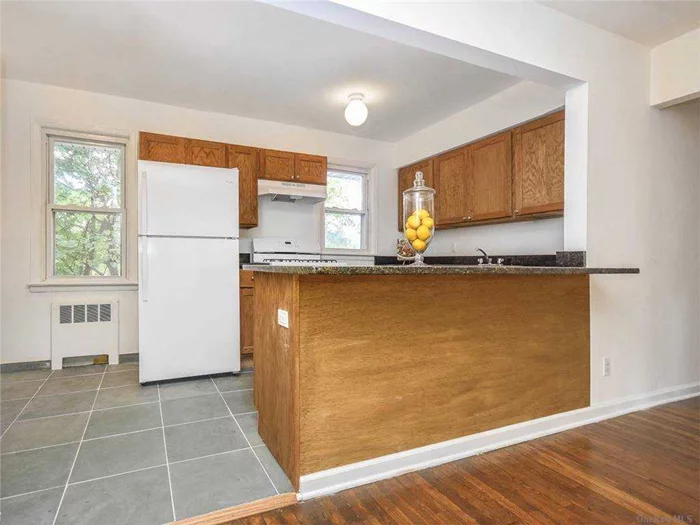 Beautiful sunlit unit with hardwood floors and a dishwasher. Laundry Room on Premise  Close to park and beaches. Photos are not actual unit - Floor plan is attached.