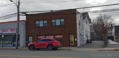 Well maintained mixed use brick building on Merrick Road, facing CVS Pharmacy,  w/1 store & 3 apts(1One BR, 2 large 3BR, 2Bath; parking at back; w/Net Operating income of approximately $43K, Cap rate of 4%; with great growth potential. Ideal for starters. Buyer should verify all information provided; Ideal for starters.
