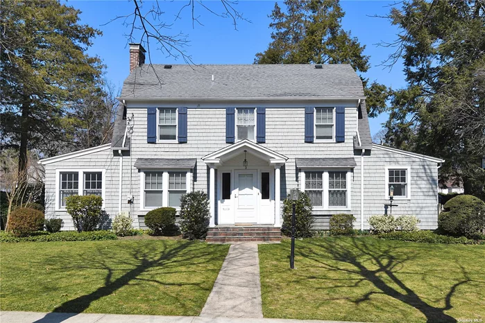 Sunny, charming and beautifully maintained Center Hall Colonial with lovely curb appeal in the heart of Port Washington Estates. Bright and inviting entrance flanked by sunlit living room with front and back windows and wood burning fireplace. Generous sized formal dining room, 1/2 bath and sun drenched sunroom/den plus eat-in-kitchen. Split landing staircase affords the convenience of a back stair. Second floor boasts master bedroom with en suite bath plus 2 more generous bedrooms and hall bath. Full staircase leads to a large attic perfect for storage. Full basement. Expansive back property ends on Vista Way. Two-car garage accessed from Vista Way. Beach and Mooring rights with fee is located at the end of The Beachway. A home for all seasons and lifestyles and a commuters dream, 0.7 miles to LIRR Port Washington Station and town.