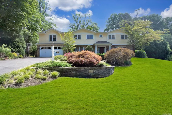 Magnificent 5 Bedroom Center Hall colonial. Approx 4000 sq ft open concept features Elegant LR, FDR, large kitchen with breakfast room & office off mud room, Laundry Rm, Amazing family room with fireplace, soaring ceilings, All overlooking amazing 1/2 acre professionally landscaped lot with covered bluestone patio/porch, built-in outdoor kitchen, firepit, BBQ, playground and room for a pool!. Close to LIRR.