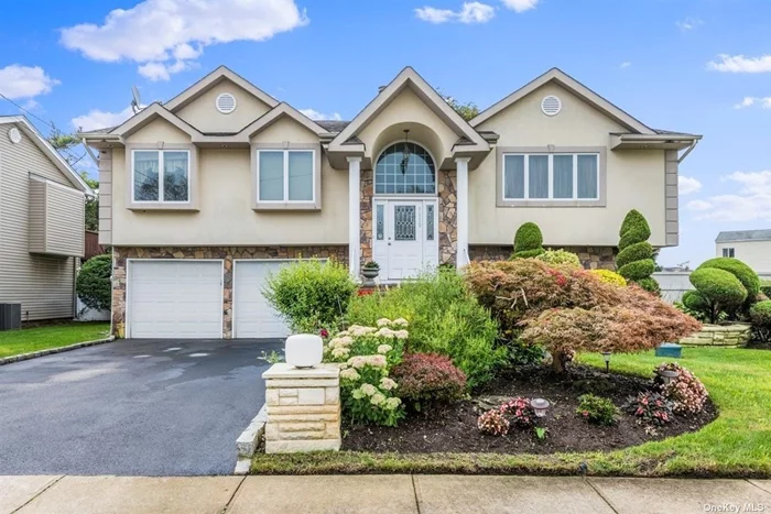 Stunning stucco, stone & vinyl-sided 5 Bdrm, 3Bth extended Hi Ranch w/2, 858 sq ft, just steps from Wynsum Park. Main level features an open EIK, Liv Rm, Formal Dining rm w/Trex deck, ext. main bdrm w/2 WICs, +wall of closets, spa-like skylit en suite bath w/jetted tub & sep. shower, HW flrs on upper level & skylit hall bath. Lower level features ext. family rm w/entertainment, office, & playroom areas, 2 bdrms down, 1 with bath, lrge WIC, cedar closet, 1.5 garage w/storage closet, sep. laundry/utility rm, sliders off den to IG gunnite, marble-dusted, gas-heated pool, surrounded by paver patio & ample areas for dining/entertaining. Andersens, architectural roof, &rsquo;07 CAC, 200 AMPs, pull-down attic, PVC fenced, IGS in front, Weil McLean oil boiler, AG tank, sep. HW heater. Taxes w/current Basic Star = $17, 997 & &rsquo;23 Grievance filed. Zone X: flood insurance not required.