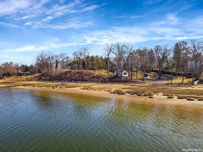 Quintessential Centre Island beachfront getaway with amazing western sunsets from this bluff overlooking West Harbor and Oyster Bay. There are many improvements including a small cottage, garage, water, and utilities. Situated at the end of a long drive on a peaceful 4.03 acres with over 415 feet of waterfront. The grounds offer a very private vacation-like lifestyle. Ready for you to build your dream house.