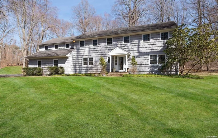 Peacefully located Overlooking Shu Swan Perserve. Located on over 5 Acres this center hall Colonial features Oversized Eat-In-Kitchen with stainless steel appliances, 6 bedrooms and 4 and 1/2Baths and a guest area, crown Mouldings, Pella Windows and Anderson Doors. Tranquility sums it all up. Move right in. Locust Valley Schools.