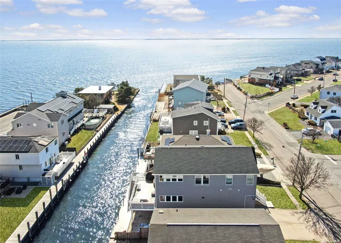 This 21 80 SqFt Waterfront Home Is Located 8 Homes From The Great South Bay! Tranquil Water Views With 40Ft Bulkhead. A Paradise For The Boater/Fisherman & A Short Trip To The Fire Islands. Legal Accessory Apartment For Income Or Room For Mom, A Rare Find On The Water. 1 st Flr Features: All New Carpeting; Family Rm W/Slider To Priv Deck, EIK, Lg Master Br W/2 Double Closets & Slider To Priv Deck; Addt&rsquo;l Br; Full Bath; Laundry Rm; Storage Rm. The 2nd Floor Features: All HW Floors Under Carpets; Foyer W/Half Moon Window; Lr W/Bay Window; Dining Rm; Eat In Kitchen; Full Bath; Master Br W/French Doors & 2 Double Closets: Beautiful Sitting Rm Adjoining The Mbr W/Slider To Priv Deck (This Was 3rd Br - Can Easily Be Converted Back); Addt&rsquo;l Br. Other Features: New Roof, Vinyl Siding, Gas Heat, 200Amp, Bradford White Hot Water Heater. Close To All & To Village For Fine Dining, Entertainment, Boutique Shops & More! NO Village Taxes. Taxes W/Star Approx $13, 220.