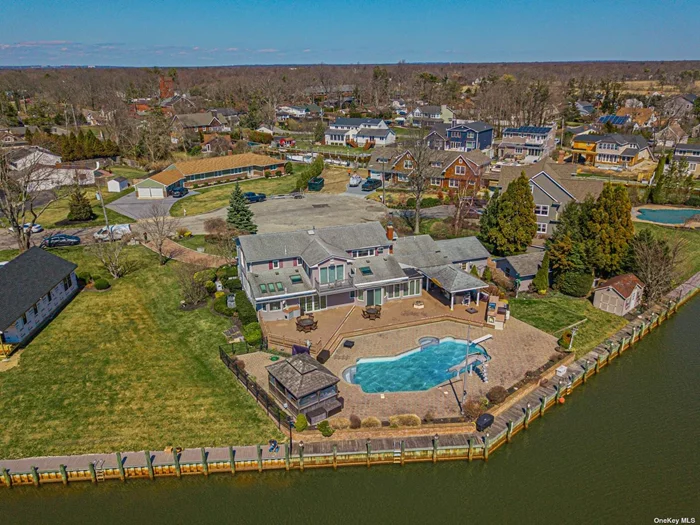 Huge 5 Bedroom Colonial Located Directly On The River. Enjoy Your Summer Out On Your Back Patio With Views of Your Inground Pool & Boats Passing By. Located On The First Floor Is Your Large Master Bedroom W/ Fireplace & a Walk In Closet, Master Bathroom & Sitting Area. There is An Additional Bedroom Located On This Floor As Well. Downstairs EIK, Living Room W/ Bar, Dining Room, Den, Powder Room. 3 Oversized Bedrooms Located Upstairs- 2 Full Baths. Huge Sitting Area Upstairs As Well, One Side Being Used As A Home Office- The Other As Gym.