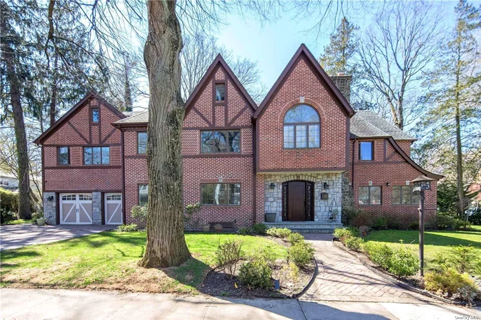 Motivated seller! This stunning sun-drenched all-brick Tudor style home was custom built by its owner in 2012 & features 3576 SF including a finished basement and an attic. A cathedral ceiling central hall leading to a gorgeous living room with granite fireplace, formal dining room, impeccable custom design kitchen with granite center island and top appliances, radiant heated floors throughout. A classically elegant oak staircase ascends to the second floor: The second floor has 4 bedrooms, The master suite with huge bathroom, custom WIC & spacious balcony; Addition 3 BRs & 2 full BAs. The spacious attic can provide a variety of functions. The balcony with double French door, 5-star energy-saving spray foam insulation, Andersen high-energy energy-saving casement, 2 sets of washer and dryer, central air condition, alarm security cameras in & out, lawn sprinklers, and 2 parking spaces. The neighborhood has private clubhouse with a pool and tennis and dedicated police patrol.