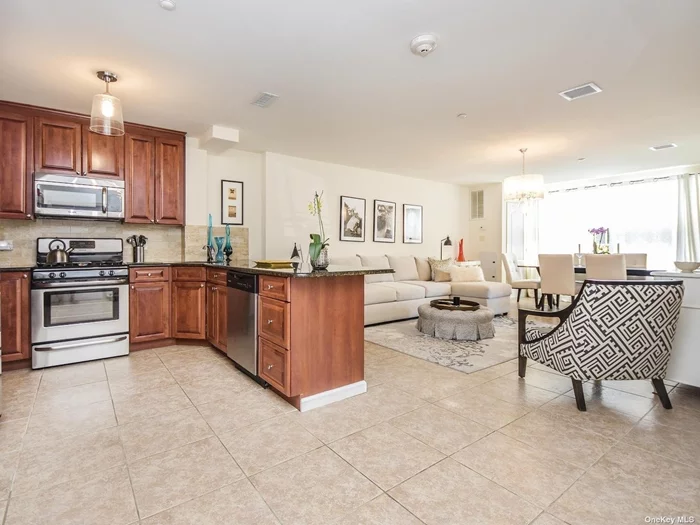 Beautiful Sunlit Unit In An Elevator Building. Offering An Open Floorplan With Granite Kitchen And Stainless Steel Appliances , Tile Floor, Balcony , Central Air, 1 Garage Spot, Laundry And Fitness Room. Located Close To Beaches, Parks, Shopping, Dining, And Transportation.