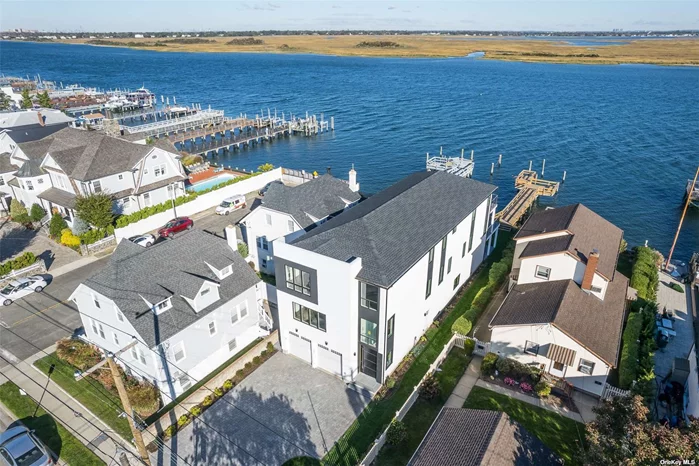 WATERFRONT******* Your time is NOW!!! Motivated Seller! 4, 000 sq.ft. FEMA Compliant Brand New Open Bay 4 Bedroom 3.5 Bathroom Home in the Artsy West End! Great room has open layout so you will see the bay from wherever you are: kitchen, formal dining room, and living room w/fireplace with sliders to oversized decking from which you can access the beautifully landscaped yard, patio, and brand new dock with a sitting area. Also a large den w/fireplace and powder room. Upstairs there are 2 master bedroom suites (North-facing and South-facing) each has own bathroom, the bay facing one has 3 walk-in closets and sliders to a bay front decking with breathtaking views of the bay and NYC... Also there are 2 more bedrooms that share a bath. Laundry room near bedrooms, CAC w/2 zones, central VAC & more! Come home to serenity, bring your boat, kayak, fishing rods... Perfectly designed for indoor outdoor entertaining. Under 1hr to NYC, near cafes, shops & beach!!!!
