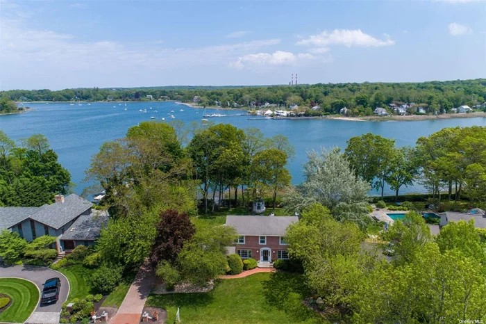 Beautiful Brick Colonial With Amazing Water View Of Setauket Harbor! This Home Features Hardwood Floors, Skylight,  Large Updated Eat In Kitchen With Granite Counters And Stainless Steel Appliances,  Formal Dining Room, Den/Family Room With Fireplace, Master Bedroom With Full Bathroom, 3 Additional Bedrooms, Hall Bathroom. Enjoy Entertaining On The Huge Rear Deck With View Of Setauket Harbor. You Won&rsquo;t Be Disappointed!!!