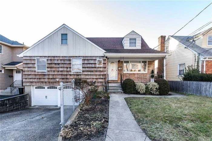 Fully Occupied Investment Property. Legal Two family on a 50x100 Lot. Tenants Share Garage & Basement. All Separate Meters. Both Tenants are staying with sale. Completely Renovated. Two Sets of Laundry and Appliances for each tenant. Separate Entrances. Two Central Air Units.