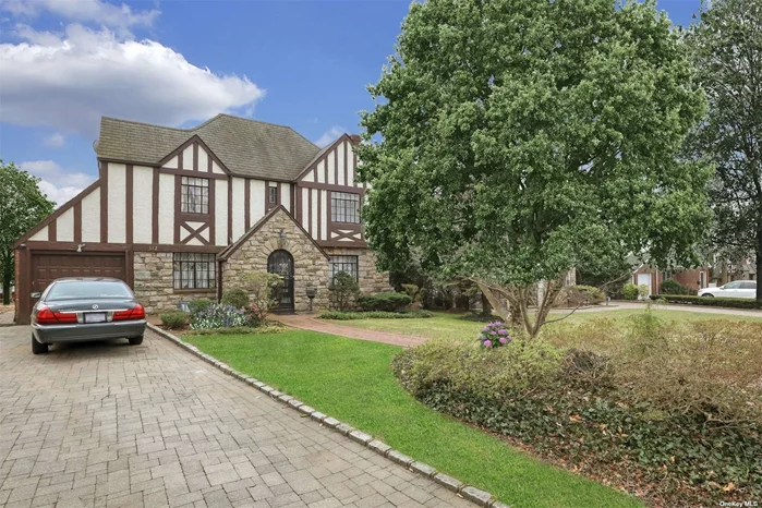 Charming, well maintained 3 Bedroom and 2.5 Bath Tudor situated in the heart of North Strathmore. This home exemplifies Tudor architecture with its gabled roof, stucco accents and stain glass which are all distinguishing features. The Formal Living Room with Fireplace is the hub of warmth in this home, with French doors leading to an all season Sunroom, which accesses the private and serene backyard and patio. Finished basement, two car attached garage, fully paved driveway, generator. Munsey Park Elementary. Close to all. Please note Virtually Staged! Please Adhere to all Covid guidelines with wearing of mask and questionnaire completion.