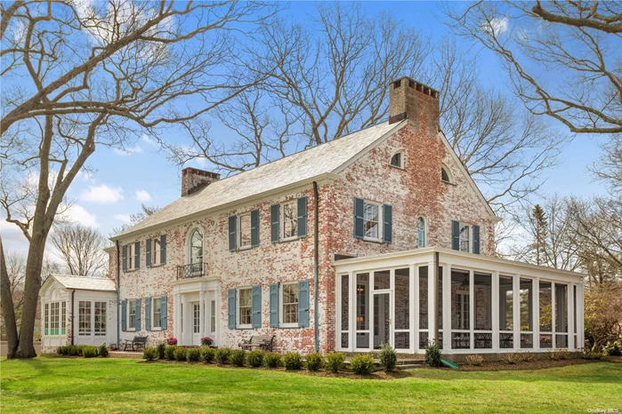 New to the Market! Original Gatsby-era estate home on shy acre with water views, deeded bay beach and protected deep water dock with direct access to the bay. Originally part of 100-acre estate, this Georgian manor home is in the desirable waterfront community of Harbor Lights. The home has been meticulously restored to it&rsquo;s original grandeur and updated with modern kitchen, central air, efficient heating system, and slate roof. Original features include a grand entry hall, formal living room and dining room- both with fireplaces, original wood-paneled library/office with fireplace, breakfast room, butler&rsquo;s pantry, kitchen. Large screened in porch with water views off the living room. Master ensuite with private morning room/office, guest ensuite, 3 additional bedrooms and 2 baths. Five bedrooms, two sitting rooms, four full & 2 half baths in all. This grand, historic home is a once-in-a-lifetime opportunity!