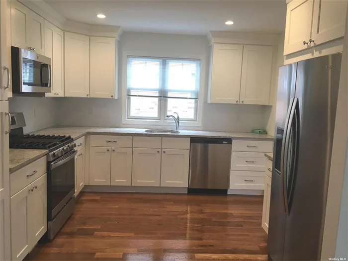 Completely Renovated First Floor Apartment on Quiet Lane in Manorhaven. New Kitchen, Baths, Floors, CAC, Windows. Shared Backyard. Close to Manorhaven Community Park, Beach and Pool.