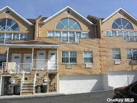 rare 10 units of 2 family townhouse in Little Neck, built in 2004, features of 2 bedroom apt over 3 bedroom apt, 2nd floor has a loft with a full bathroom due to high ceiling, balcony on the 2nd fl , new windows in 2016, hardwood floors throughout, 2 car garage and 3 parking spots included, playground in the common area, near to public transportation Q30, QM5, best school district #26, P.S.221, MS67, Cardozo HS, Great investment property, good rental income producer! 2014 installed 2boilers, 2 hot water tanks,  Great location near to school, near to supermarket, 495 Expy exit 32, this is not a condo, Low HOA Fee $106.85 covers snow removal & lawn care only.