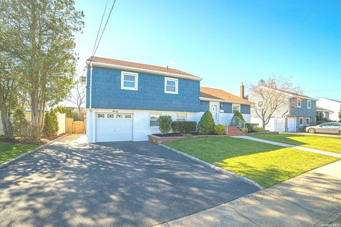 Wideline Split in the Heart of Massapequa Shores. Large Bright & Airy Living Room, Dining Room with Sliders to Rear Deck, Eat in Kitchen, Beautiful Hardwood Floors, Central Air, Freshly Painted, Well Maintained and Ready to Make Your Own. Fenced in Oversized Yard, Shed. All Nestled on 75 X 112 Property. Low Flood Insurance $572. Home is Sold AS IS