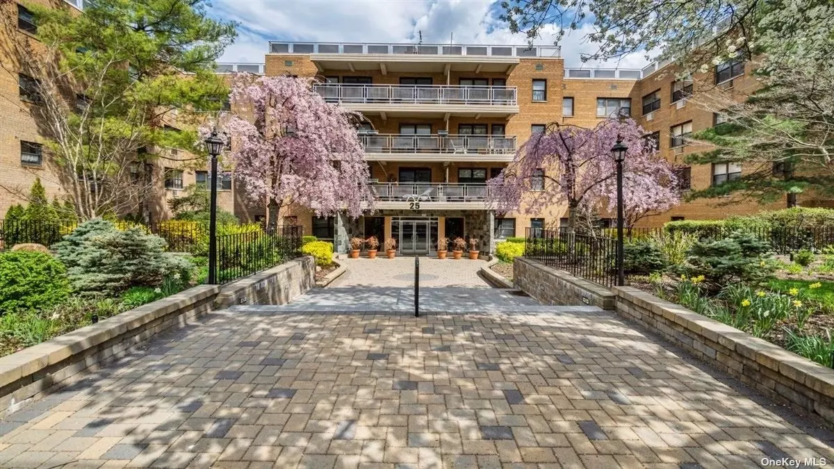 This Jr4 coop located in the prestigious building known as The Dorset at 25 Park Place. This first floor apartment is not on the ground level. Step out to your own private patio that is over 300 sq ft. with a view of Grace Ave Park. Lots of natural sunlight throughout and a view of the park from the bedroom as well. This elevator building has a newly decorated lobby. The apartment comes with an indoor parking spot. Additional storage and a bike room is available. Historically low maintenance in this building shows the fiscal strength of this coop. The bathroom and kitchen have been updated and there are French doors to the additional room which also leads to your outdoor patio. Parquet Wood floors and crown moldings throughout give this coop a finished look and feel. Close to town, LIRR and part of the renown Great Neck Park District. Optional school zone!