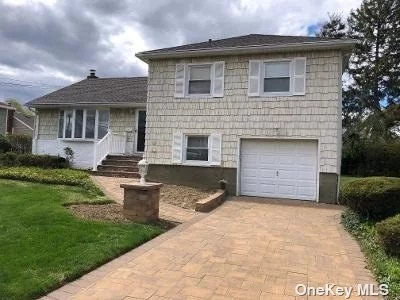 Location, location.Large split level home. All large rooms, Family room with wood burning fireplace, CAC , 200 amp service, updated gas boiler, updated roof, (2014) all new pavers in front , Beautiful large property  in ground sprinklers