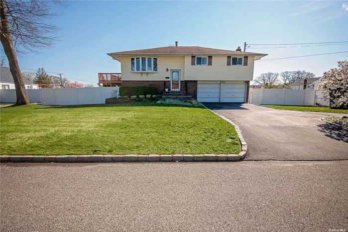 One of the largest hi ranches in the area, has been expanded with large eat-in-kitchen, 3 full baths, hardwood floors, living room, dining room, large den. Plenty of living space w/potential for mother/daughter, oversized immaculate property w/outside deck, move-in-ready.