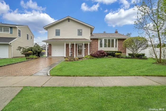 Prime Mid-Block Location! in Jericho School District w/Seaman Elementary!. This Spacious & Bright Layout Has Vaulted Ceiling, Dining Room, Eat In Kitchen Overlooking Family Room and Finished Basement. Oversized landscaped back yard!.Conveniently located to Shopping & Transportation!.