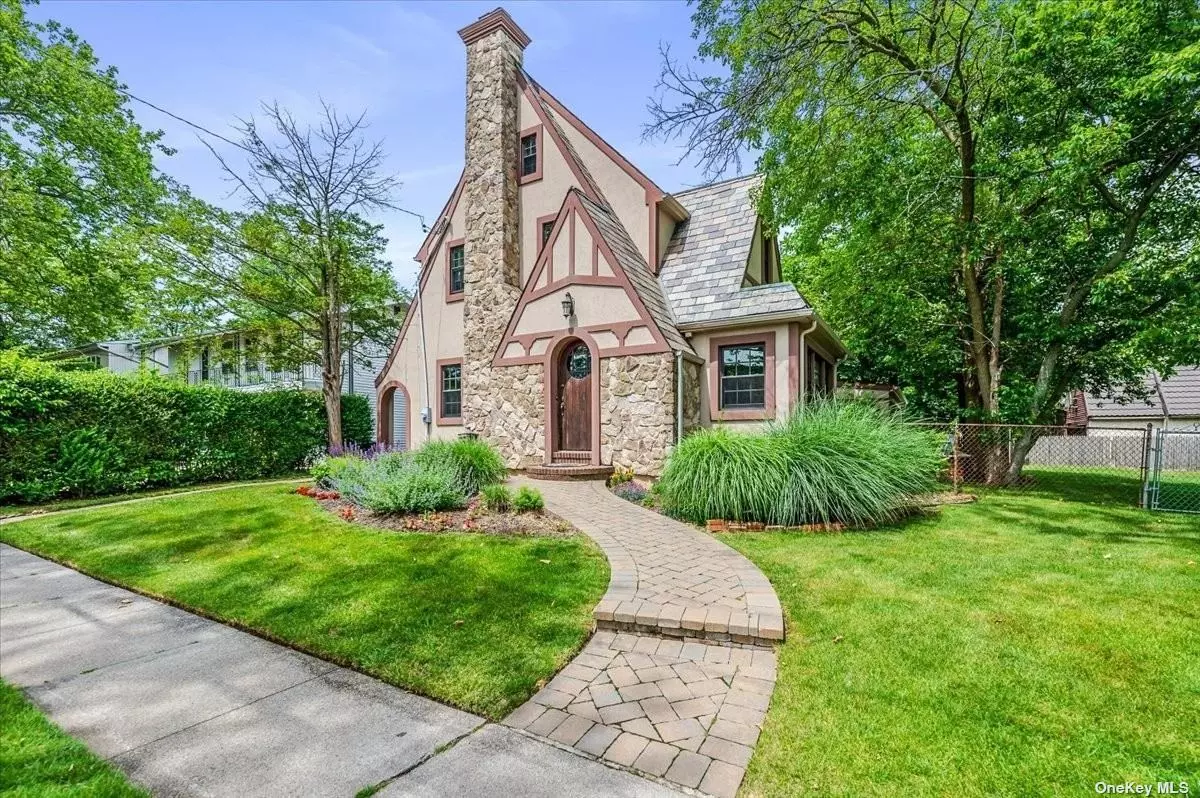 One of the original 12 houses built in The Estates section! Prime mid-block location on 200&rsquo; deep lot (10, 999 sq ft). Tastefully updated 9 Room Tudor style Colonial offers 3, 115 sq ft stucco exterior slate roof featuring 5 bedrooms and 3 full bathrooms, open LR w/fireplace/FDR, breakfast area, family room w/fireplace, MBR ensuite with fireplace (possible to vault ceiling) main level bedroom plus new full bath. Large Entertaining Areas, New Granite Kitchen, Gas Cooking & Heat, Finished 3rd Floor, 3 Wood Burning Fireplaces, Hardwood Floors through-out, Large fenced yard with room for a pool, 2 car attached garage plus extra deep driveway plenty of room for parking, Near everything.