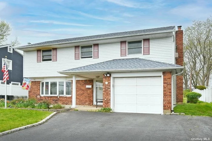 Great Splitl in the Heart of Island Trees on over a quarter acre property. (50x250)  Updates include Heating system and Roof,  Attached Garage and Half finished Basement.  A Rare Find! Make it yours.