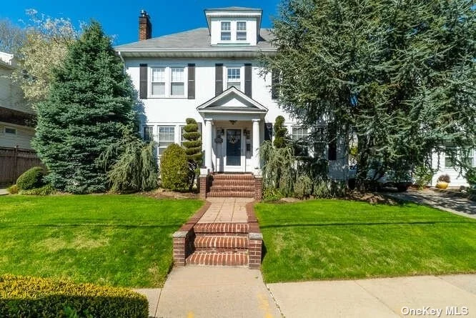Beautiful Center Hall Colonial, large rooms, high ceilings, 4 bedrooms, large backyard, updated baths, EIK w granite counter tops and solid wood cabinets, Many more extras, must see , close to all transportation and shopping.