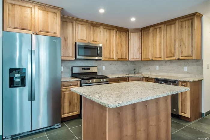 Beautiful sunlit unit with an open floor plan - A 1 car garage with entry to unit - Washer and Dryer in the unit and a relaxing terrace. Close to shopping, dining, and transportation.