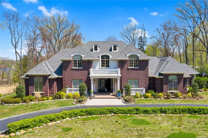 Welcome to Kings Point. A circular driveway leads to this Custom built home by this owner...no expense spared! This pristine home features every conceivable amenity. Enjoy cooking in this exquisite chef&rsquo;s kitchen with top-of-the-line Viking appliances and custom-built cabinetry. Adjacent to the kitchen is the 2 story family room with french doors opening to a magnificent veranda. In addition, the patio can be accessed from the master suite featuring custom cove lighting, his and hers separate walk-in closets, and a luxurious ensuite bathroom. Two other bedrooms and a bathroom complete the main floor. A balconied second floor overlooks the main level and has three additional bedrooms, a separate sitting area, and a bathroom. The lower level is perfect for large parties or recreational activities with a large gym,  billiard area, 2 additional bedrooms, and bathroom. This one is irreplaceable!