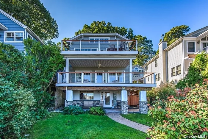 Renowned For Its Dramatic Coastline Views, this 3 Story Home Is Defined By Its Panoramic Water Views From Most Rooms. An Extensive Renovation Was Completed In 2013, Creating This Home Of Beautifully Positioned Rooms, and Every Modern Amenity. Beautifully Hardscaped Porch with a Private Outside Shower. 1st Floor Consists of a Full Bath, and Large Versatile Great Room. Upstairs to 2nd Floor Includes Master BR with a WIC, Private Deck, 2 additional bedrooms with Large Double Lighted Closets, Laundry Closet, and Full Bath with Double Sinks, Ample Storage, and Separate Shower & Tub. 3rd Floor Contains a LR with an Elegant Gas Fireplace, Formal DR with Door to Deck, Half Bath, and Grand EIK with an Island, 2 Sinks, Tremendous Pantry, Ample Storage, Newer Appliances, and Dual Energy Oven/Range. Home Ownership Offers Private Beach Association, Self Mooring & Minutes To Golf, Theater, & Shops. Note additional private driveway in rear of home allowing direct access to Great room.