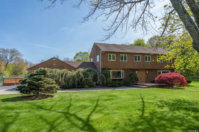 Center-hall Colonial on flat usable property. Tennis court and in-ground pool (as is) as well as two room cabana. Wonderful for entertaining and everyday enjoyment. In-ground sprinkler system. Hardwood floors. Spacious Bathrooms and Kitchen. Family Room with fireplace. Kitchen, Great Room and Foyer have granite floors. First floor Laundry Room. Upstairs Marble Bathrooms. Water filtration system. Convenient to all. Laurel Hollow beach, mooring and dock rights. Cold Spring Harbor school district #2.