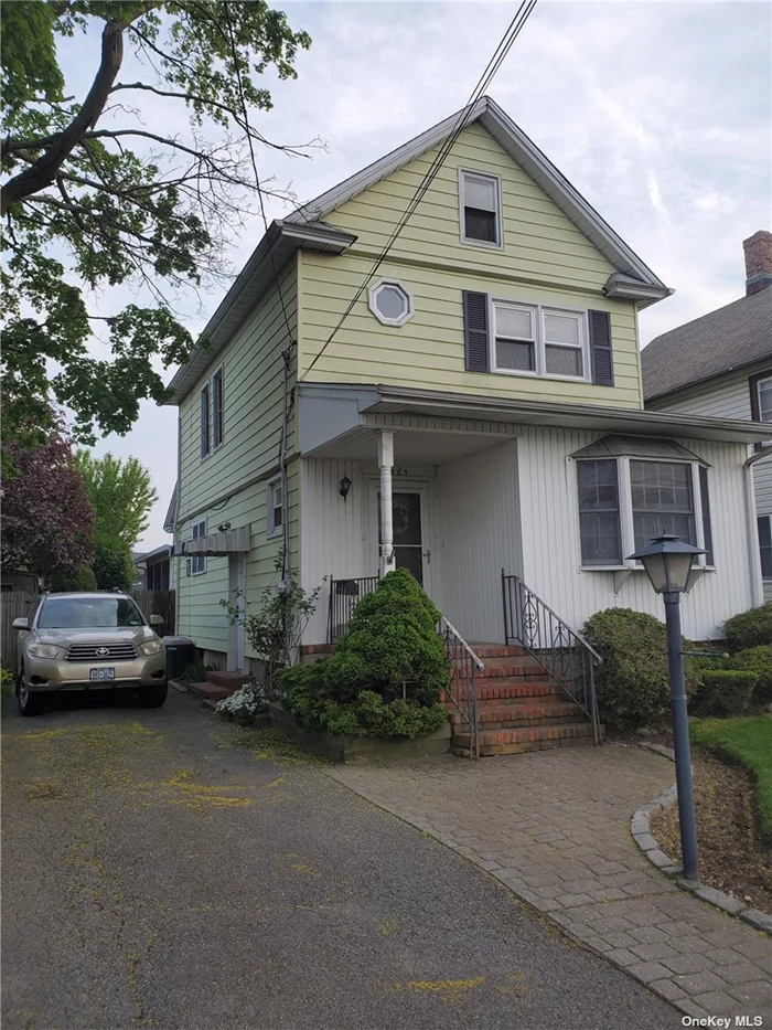 3 bed 2 bath colonial with a walk up attic enclosed sun room and a large yard close to all !