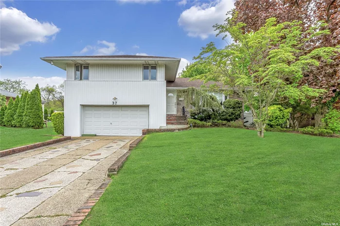 Come see this beautifully manicured, 3-bedroom, 2.5 bathroom home in the heart of Woodbury. This split-level home features an updated kitchen with a spacious open floor plan for entertaining. The kitchen overflows into the dining room and formal living room. Downstairs is a family room with sliding doors that lead to the backyard. Outside, the pool, multi tier deck, and patio provides ample space for entertaining and relaxing. This home features 4 zones of heat, radiant heat on the main level, gas cooking, gas and oil heat, CAC, underground sparklers, and an alarm system. This home is zoned for Syosset schools.