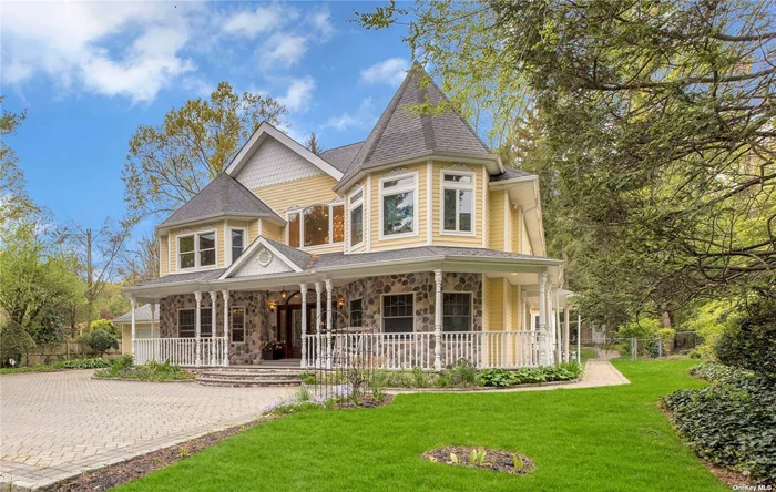 This palatial custom Victorian-inspired home was built in 2006, impressively sited down a long gated paver driveway and offers 5780 square feet of luxe living with 5 bedrooms, 3.55 baths and home offices. Situated on over 1 acre of spectacular, lush, professionally landscaped property w/ a heated gunite pool and cabana, this impressive home provides the perfect setting for easy living and exceptional entertaining. The 2-story entry boasts an extraordinary grand staircase with carved wood railings and the open floor plan provides generous rooms with hardwood floors and high ceilings throughout. Special features include thick Onyx counters in the kitchen, surround sound, and in the Master bedroom a huge walk-in closet, sumptuous bath with whirlpool tub and steam shower. Must see this amazing residence with 5-zone gas heat, 4-zone CAC, 2-car garage and finished basement. Low taxes: $23, 011 ($22, 067 w basic STAR); part of award-winning North Shore SD, bus stops at the end of the driveway!